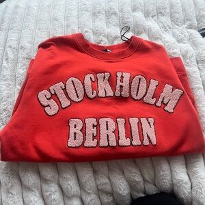 Orange H&M Oversized Crewneck with Stockholm Berlin Print